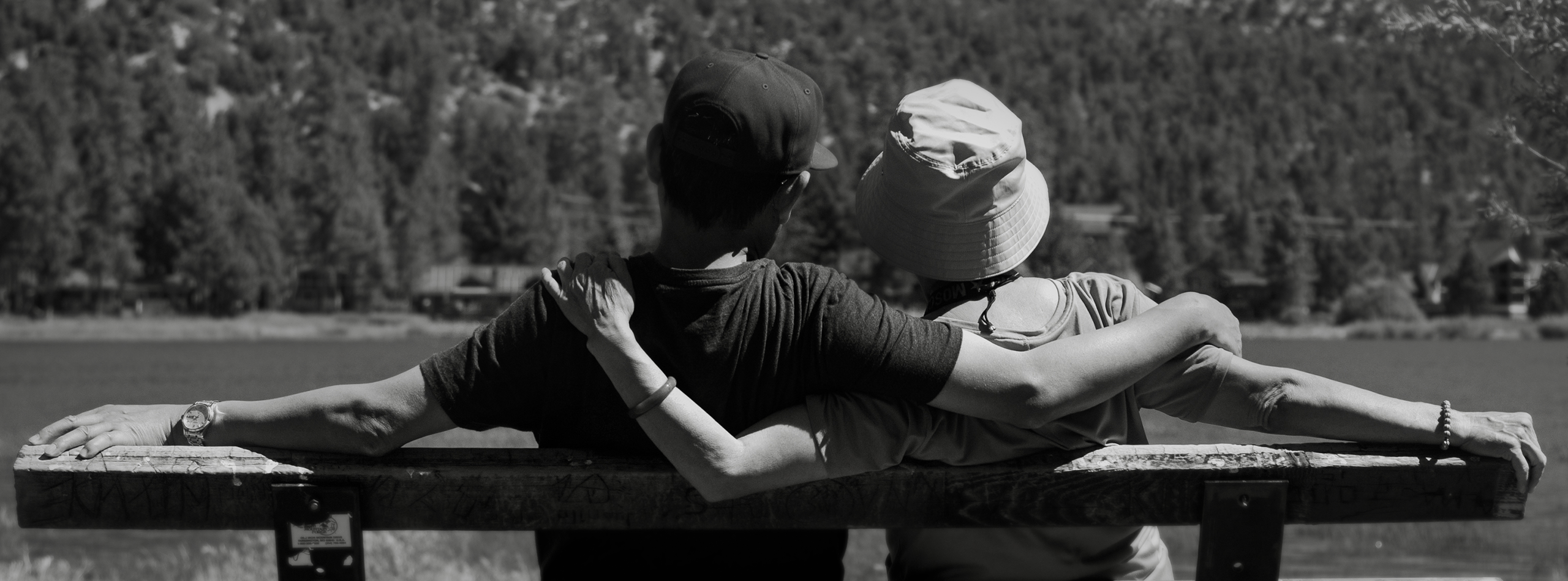 Photography � black and white landscape with two people on a bench