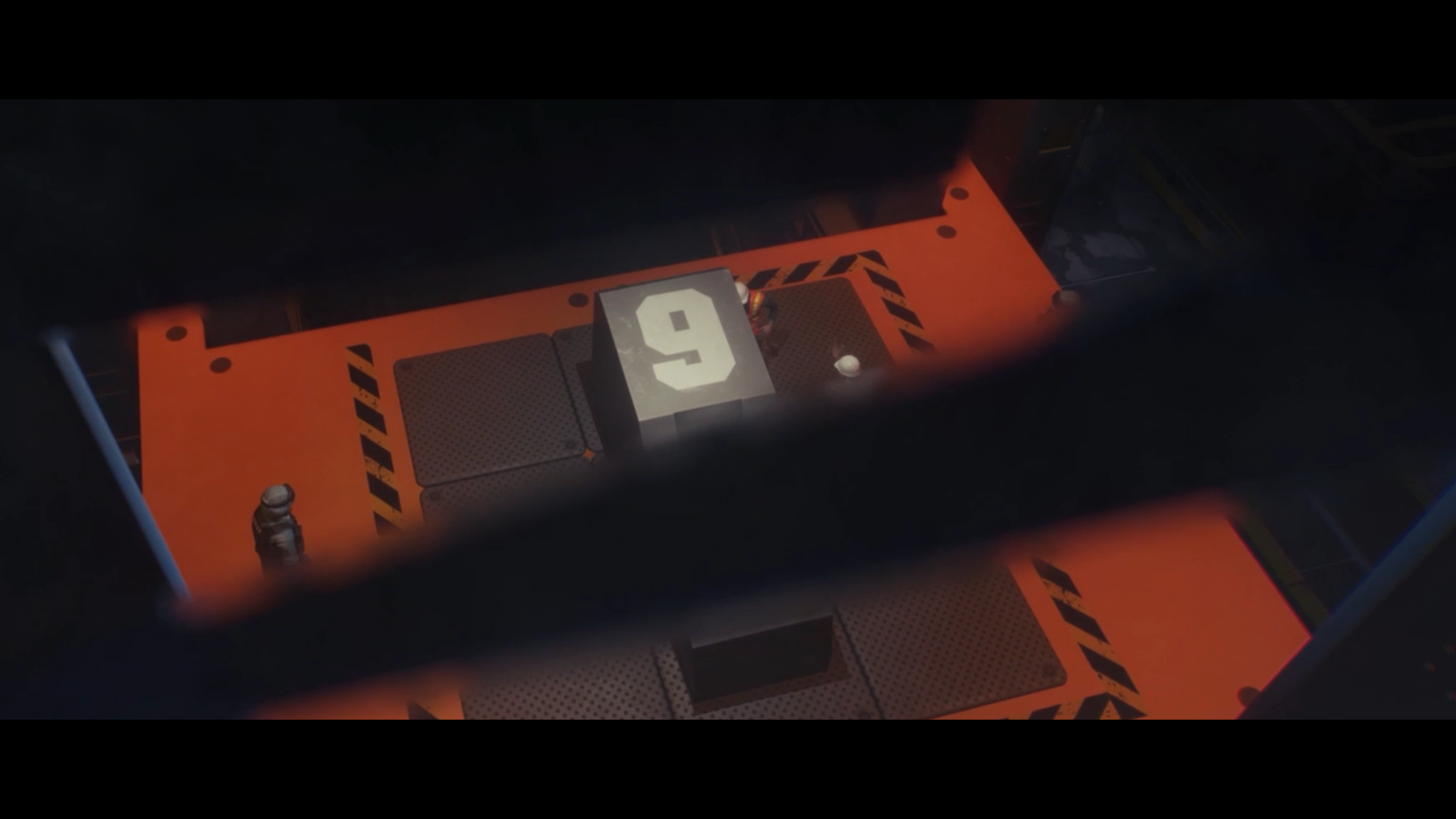 Top-down industrial loading bay with a large numbered cargo cube and crew in white helmets