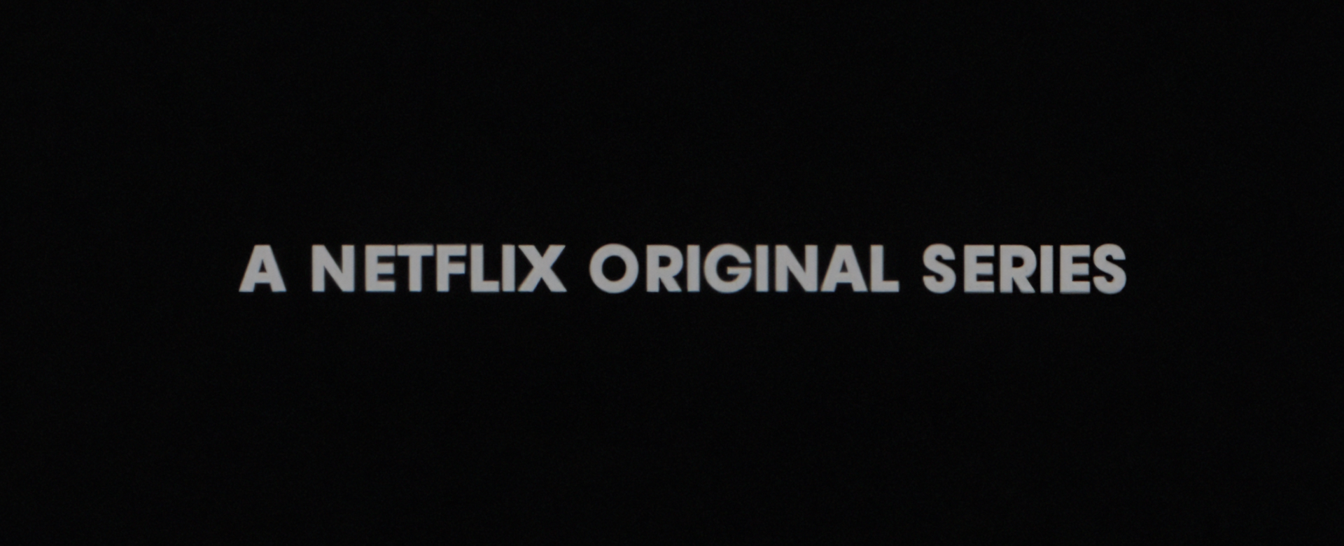 Title card: A Netflix Original Series on film grain