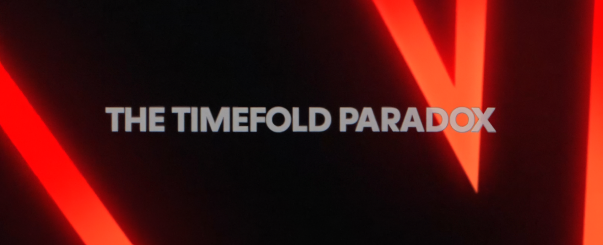 Title card: The Timefold Paradox — glowing red geometry